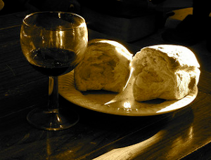 Bread & wine sitting on a table