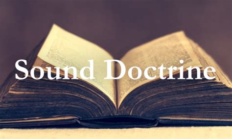An open book of Scripture laying on a table.
