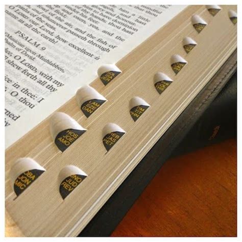 Image of an open bible with indented index tabs on the side